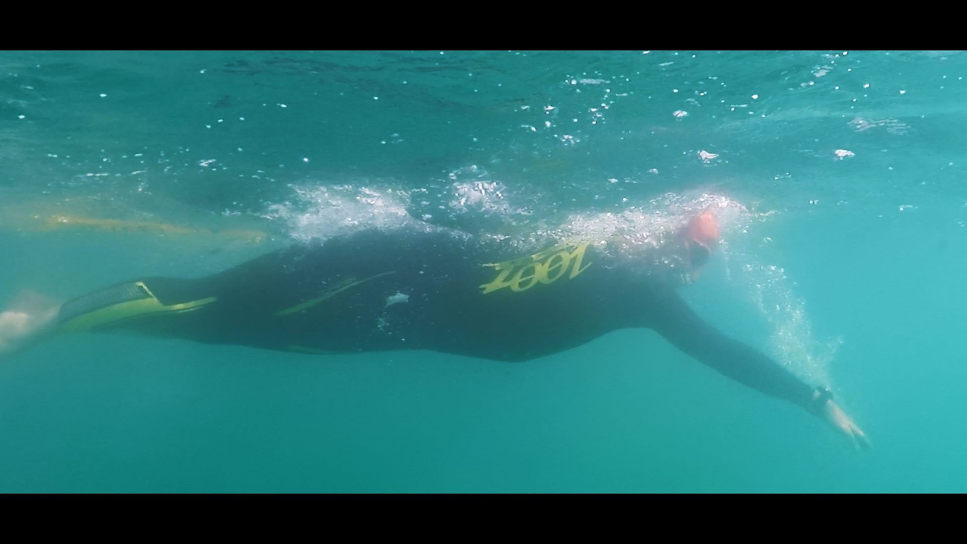 An Austria man swimming in the ocean.