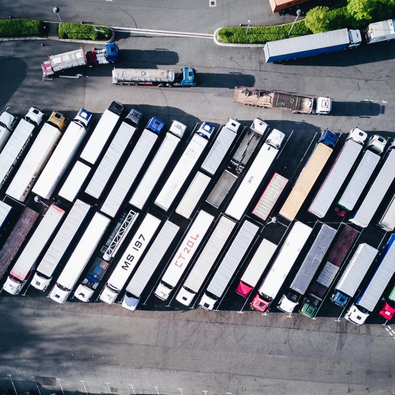 A lot of Intellic trucks parked in a parking lot.