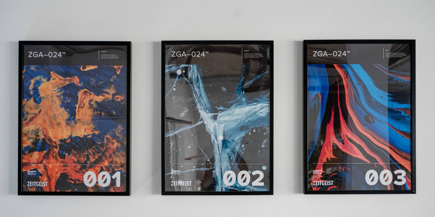 Three framed posters with different colors of paint on them.