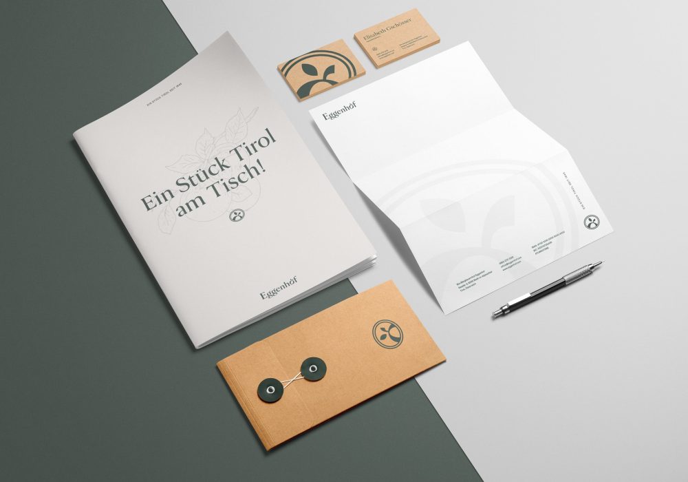 A set of Eggenhof business cards and stationery on a table.