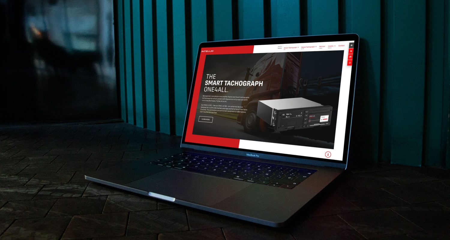 A laptop with a red screen is sitting on a table.